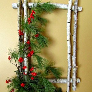 natural Birch Wreath Frame with evergreen and berry sprigs 