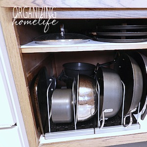 https://www.prudentpennypincher.com/wp-content/uploads/2019/01/How-to-Frugally-Organize-Pots-and-Pans.jpg
